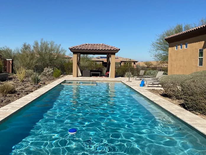 Clear lap pool with gazebo and desert landscaping North Phoenix